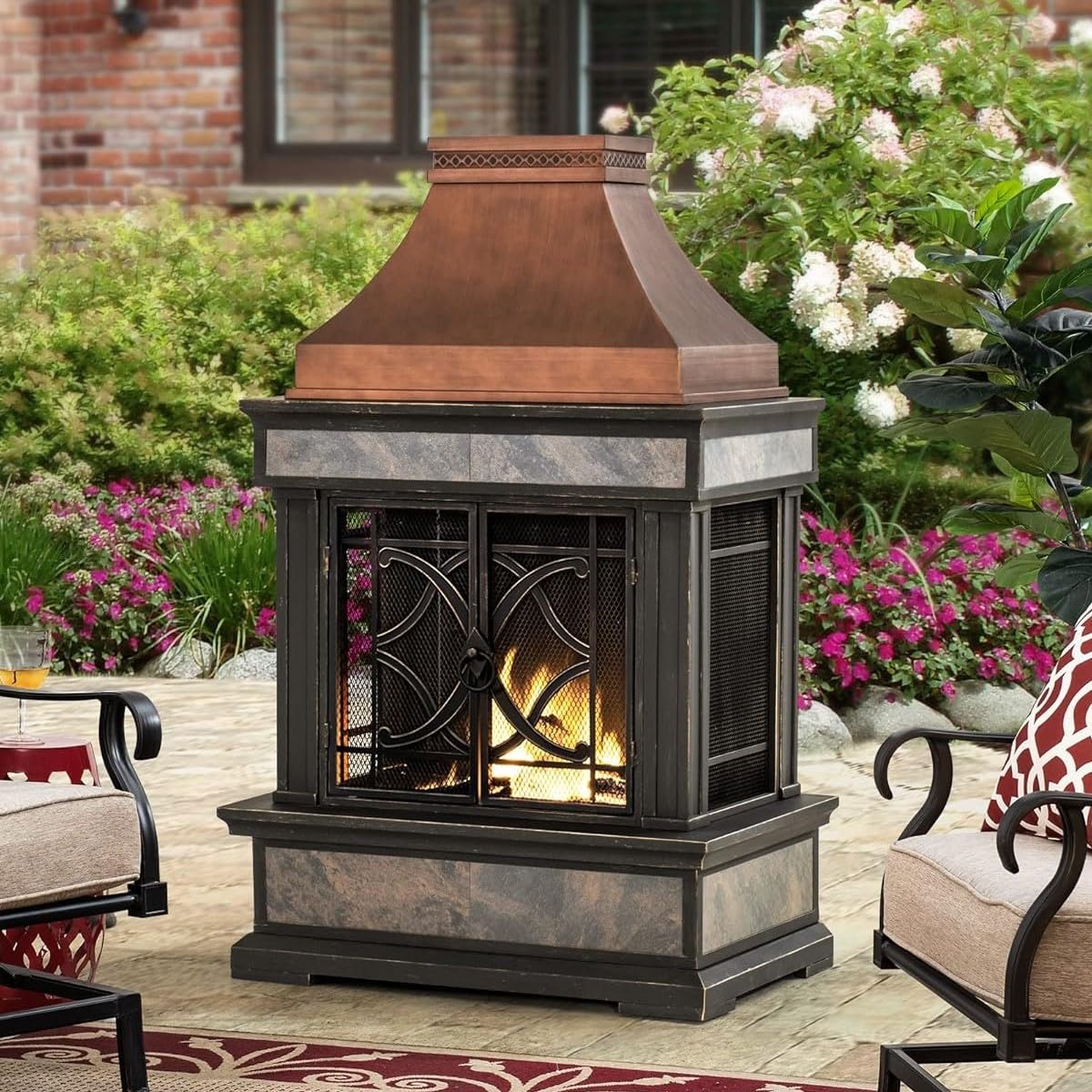 Sunjoy Outdoor Fireplace, Stone Look Tile Patio Wood Burning Steel Fireplace with Chimney, Spark Screen, Fire Poker, Rain Cover, and Removable Grate, Black with Golden Highlight